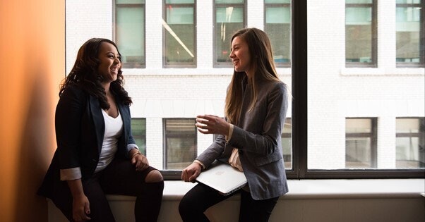 Two employees talking about coaching as a tool for employee growth