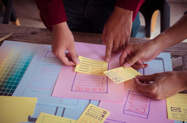 Group of people planning service design to improve public sector performance