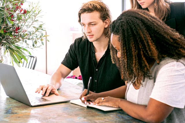 Three employees learning how to encourage effective continual learning in their organisation