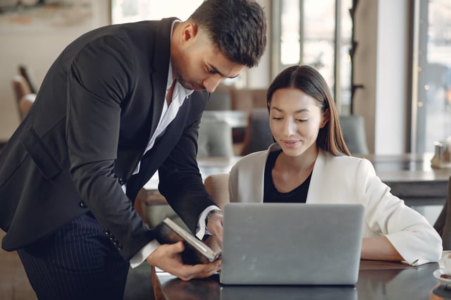 Two employees learning how to use neuro-linguistic programming in the workplace