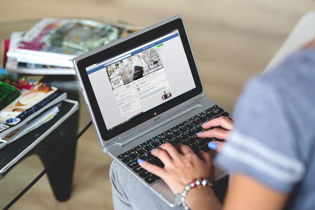 Person using their laptop to learn how the public sector can use social media in a post-COVID world