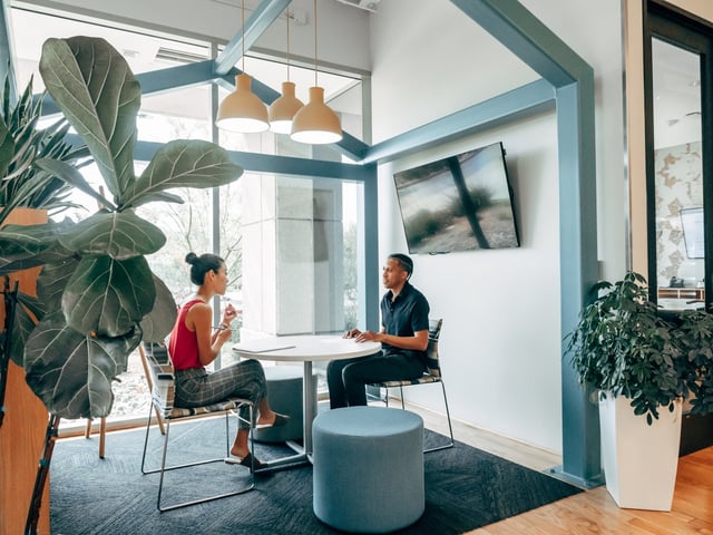 Two employees learning about strategies to improve communication in the workplace