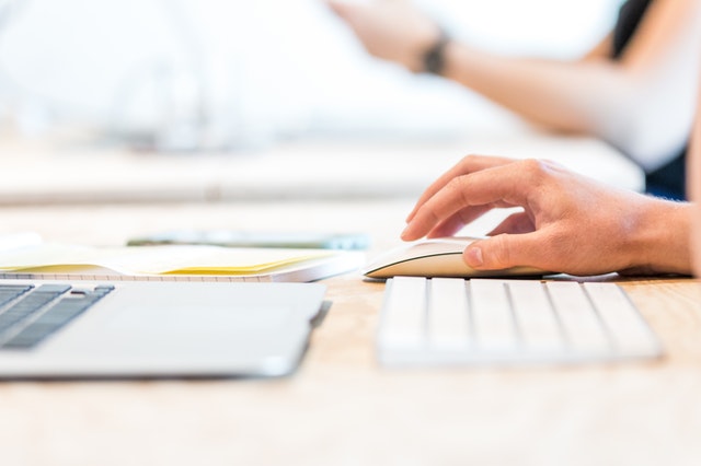 Person working on laptop to boost their digital skills and enhance their career