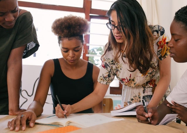 People collaborating to demonstrate tips for new managers