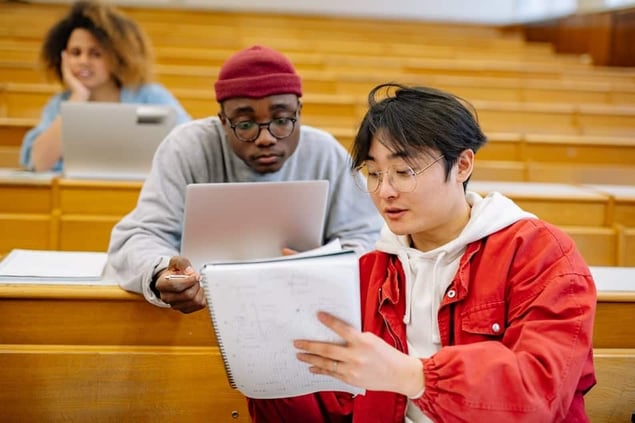 Two students learning about their student experience