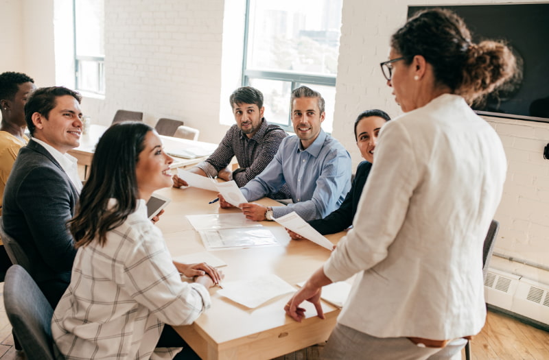 Person stood at front of people showing their situational leadership style