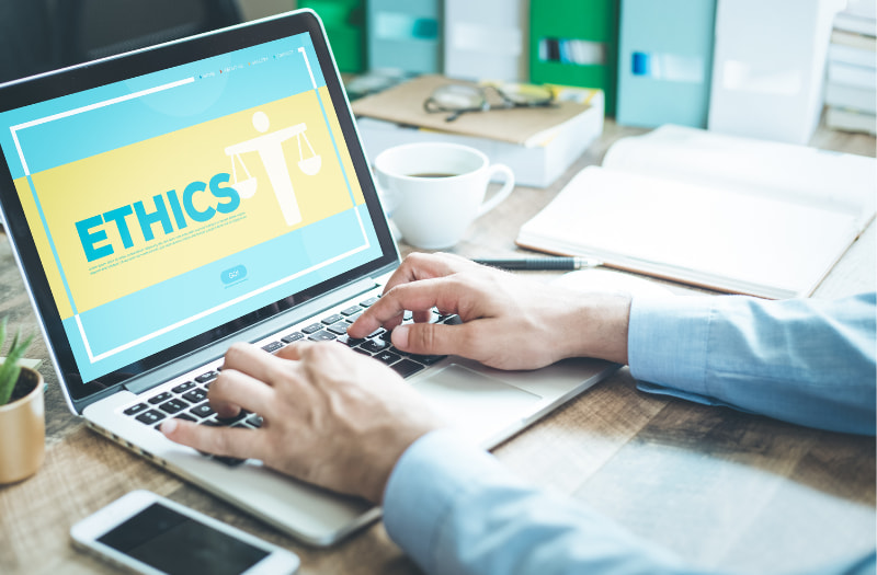 person using a laptop to conduct ethical procurement in the public sector using best practices
