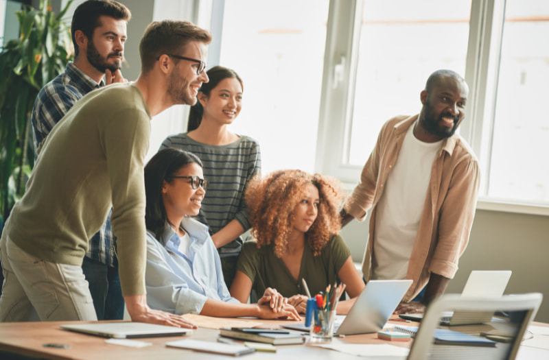 Group of people listening to five learning and development strategy examples