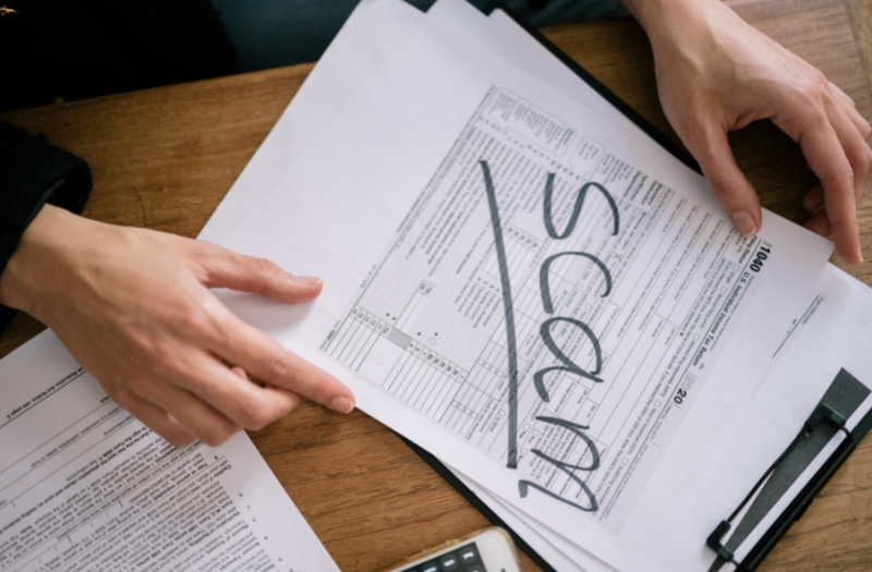 person looking at paper to help eliminate public sector fraud
