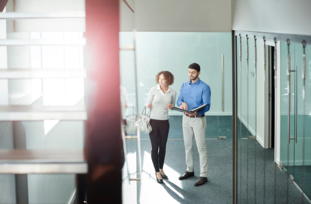 Two people conducting a premises compliance audit in person