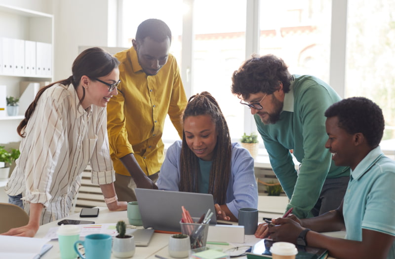 Team collaborating on a project in the workplace
