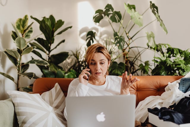 Woman trying to manage and resolve remote work conflict from home