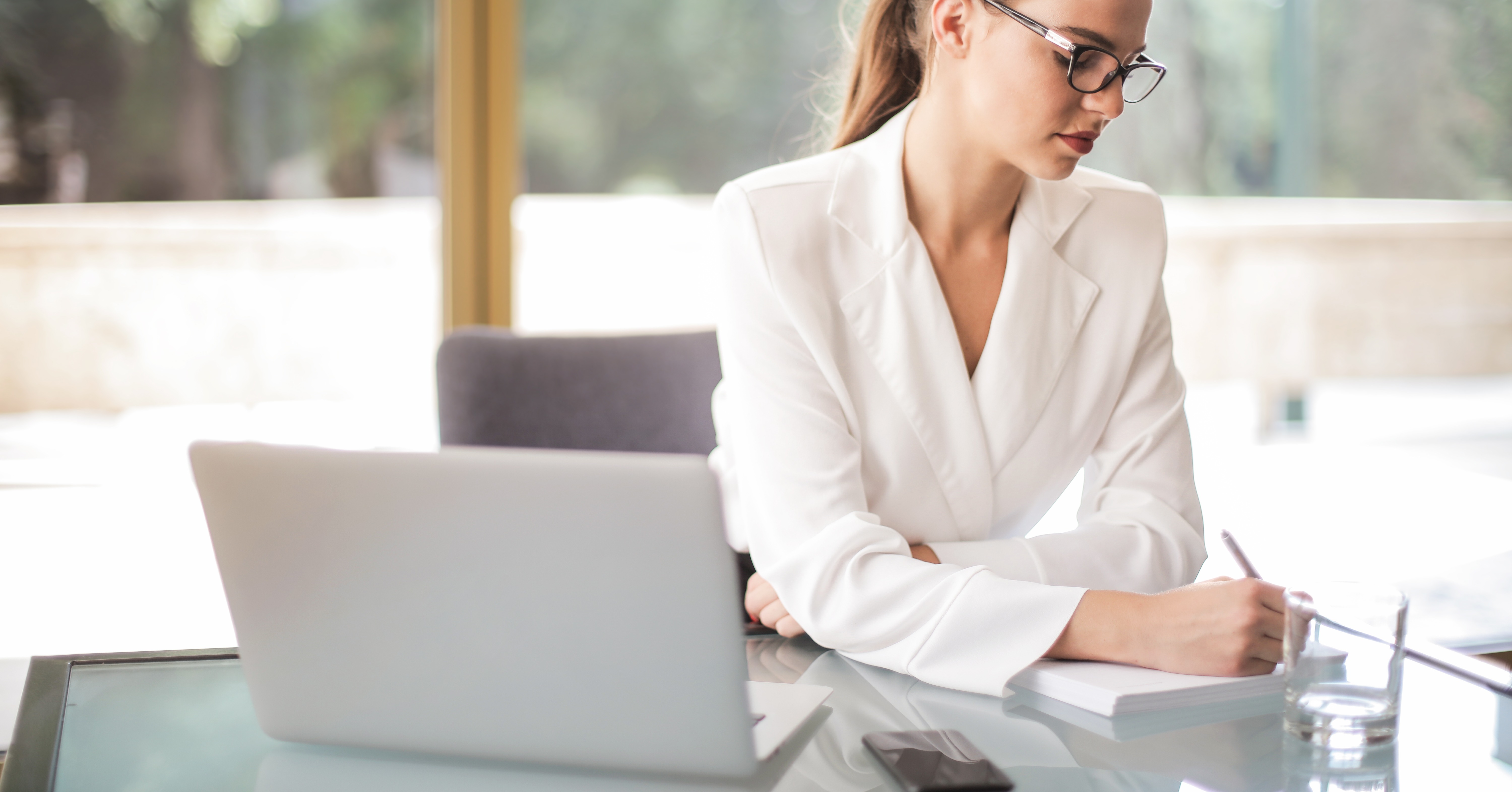 Woman with laptop learning how to respond to complaints in the public sector